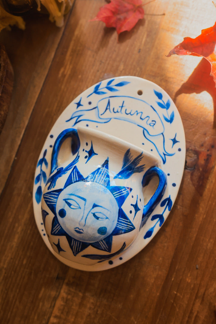 September Autumna Sun Wall Pocket in Painted Blue-On-White Porcelain