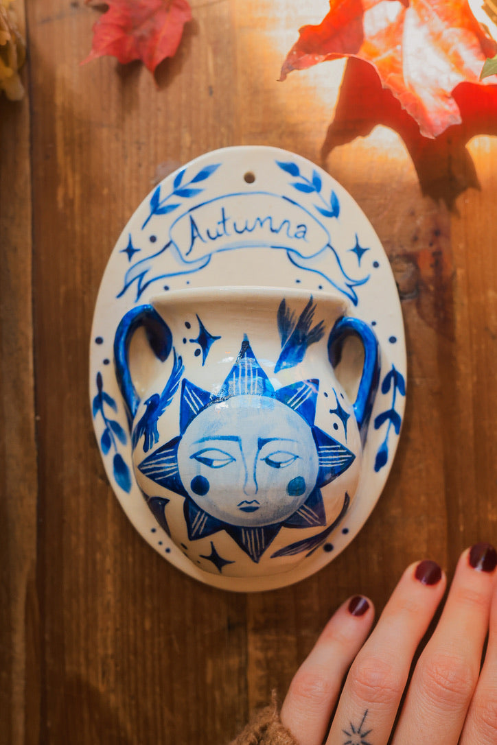 September Autumna Sun Wall Pocket in Painted Blue-On-White Porcelain