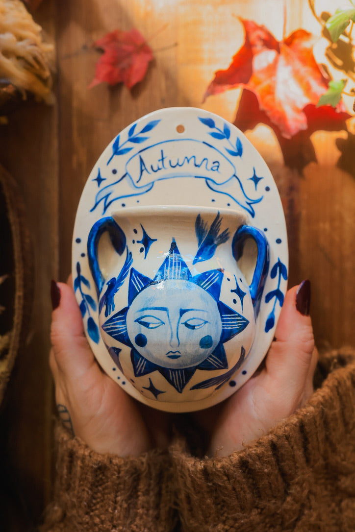 September Autumna Sun Wall Pocket in Painted Blue-On-White Porcelain