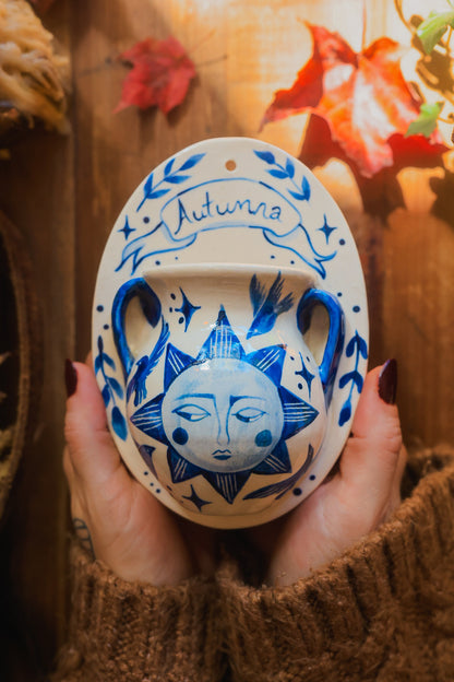 September Autumna Sun Wall Pocket in Painted Blue-On-White Porcelain