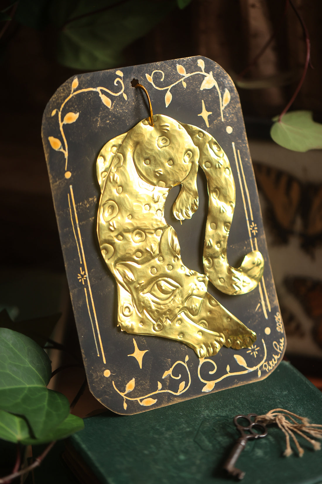 Golden Snow Leopard Talisman in Antique Brass